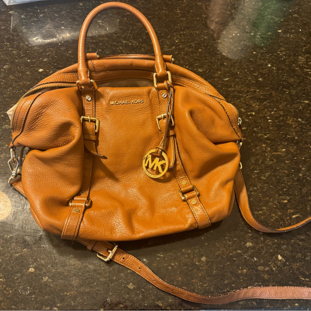Authentic large leather Michael kors bag handles and crossbody strap. Cognac